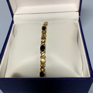 Hugs and kisses 14kt gold and onyx bracelet.